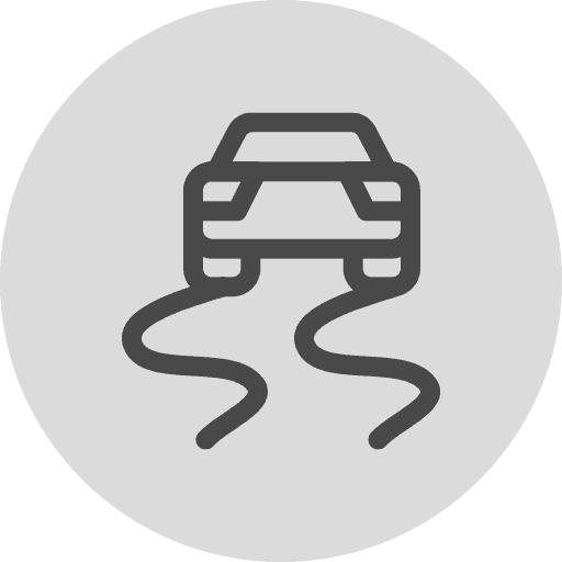 Icon of a car skidding with curved tire marks on a gray circular background.