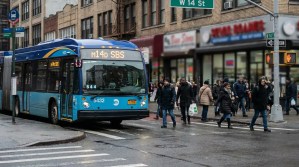 MTA M14D SBS bus number 5432 at W 14th Street intersection with pedestrians crossing